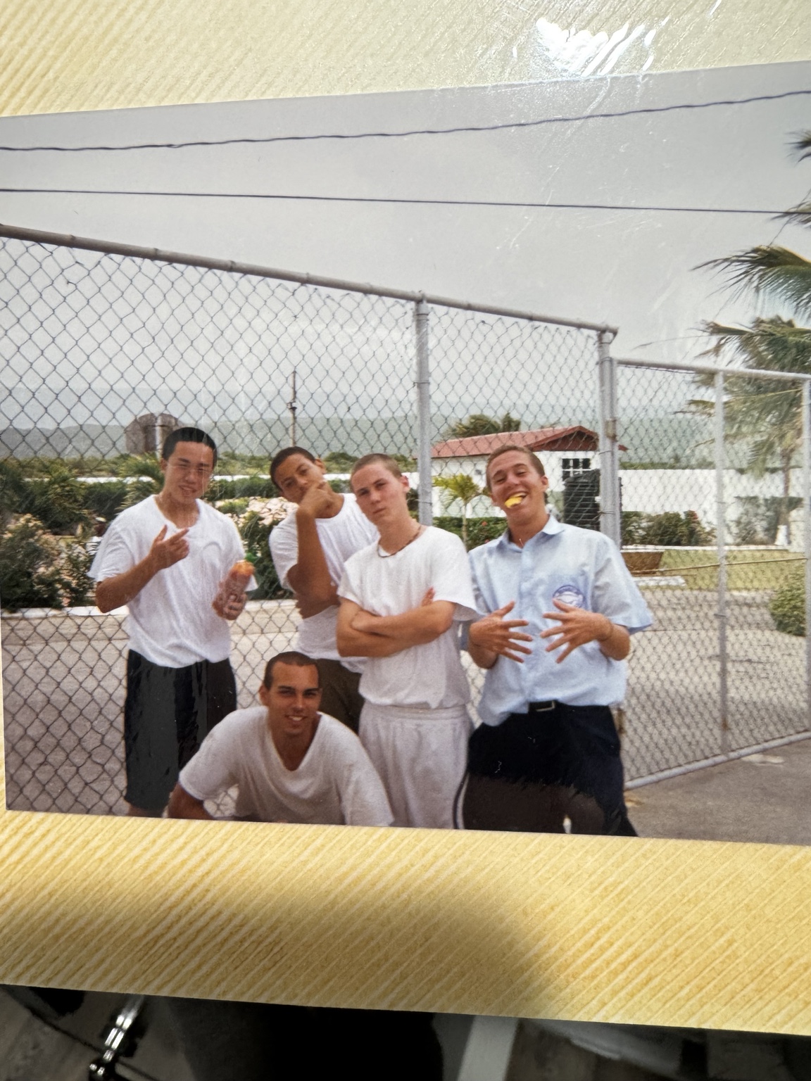 A group photograph retained on an album page.