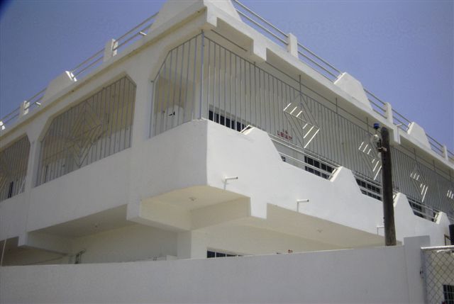 A close view of a building balcony and its railings.